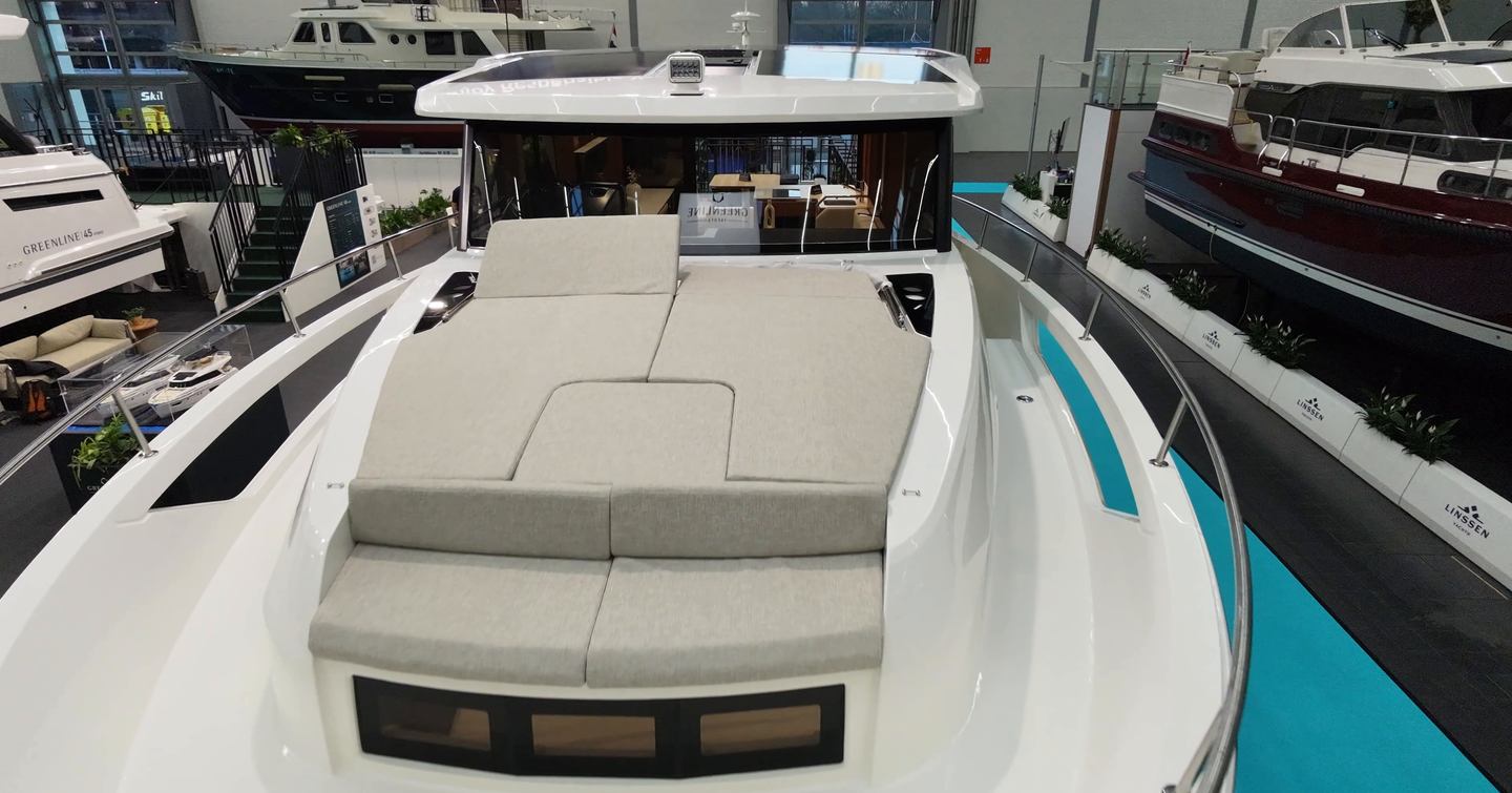 Greenline 42 foredeck sunpad with forward bench and wraparound rails