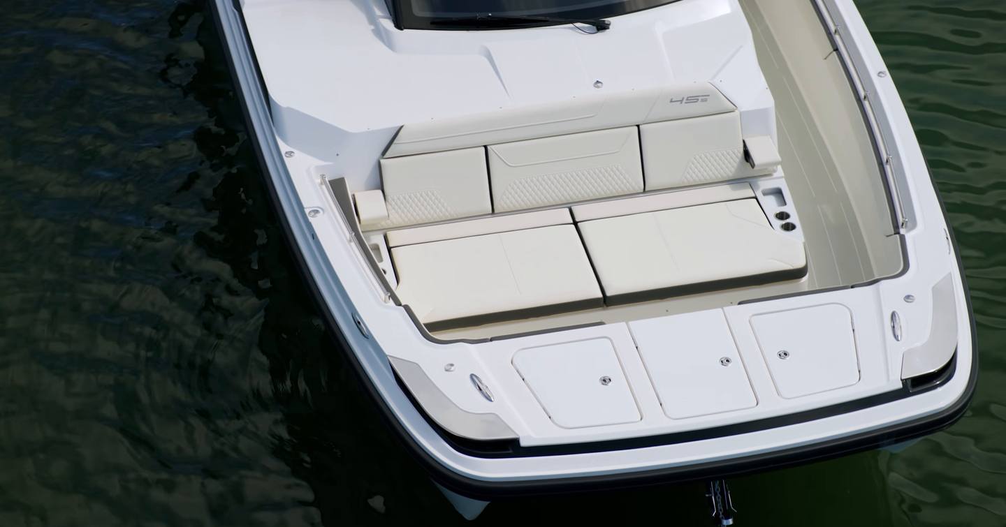 Aquila 45 Sport foredeck sunpad and seating from above, showing forward lounge layout and integrated storage hatches