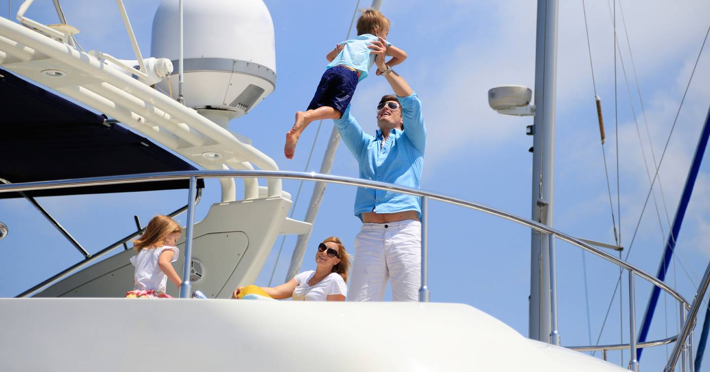 Family on a yacht having fun 