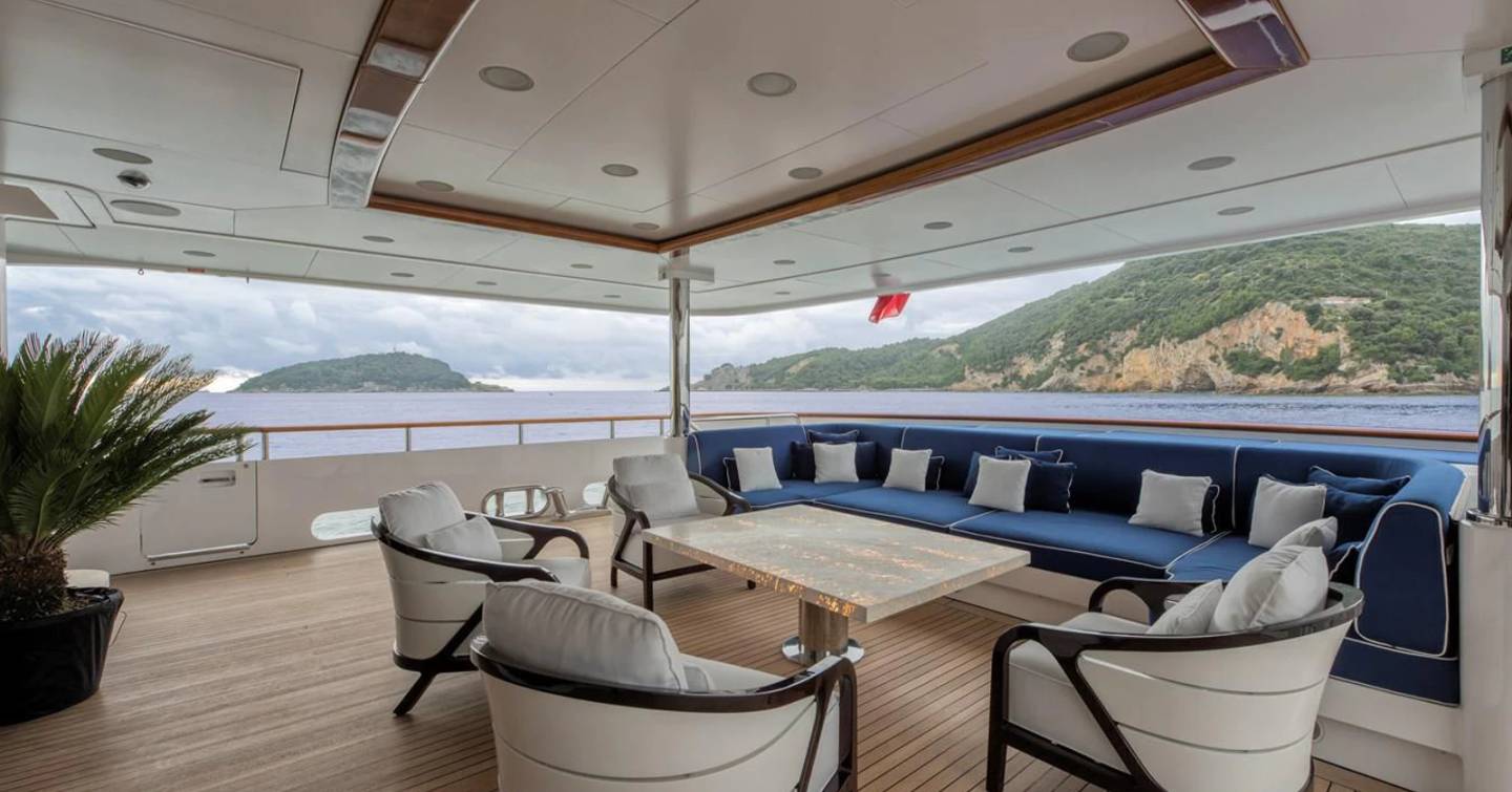 Superyacht Rhino main aft deck with shaded alfresco dining