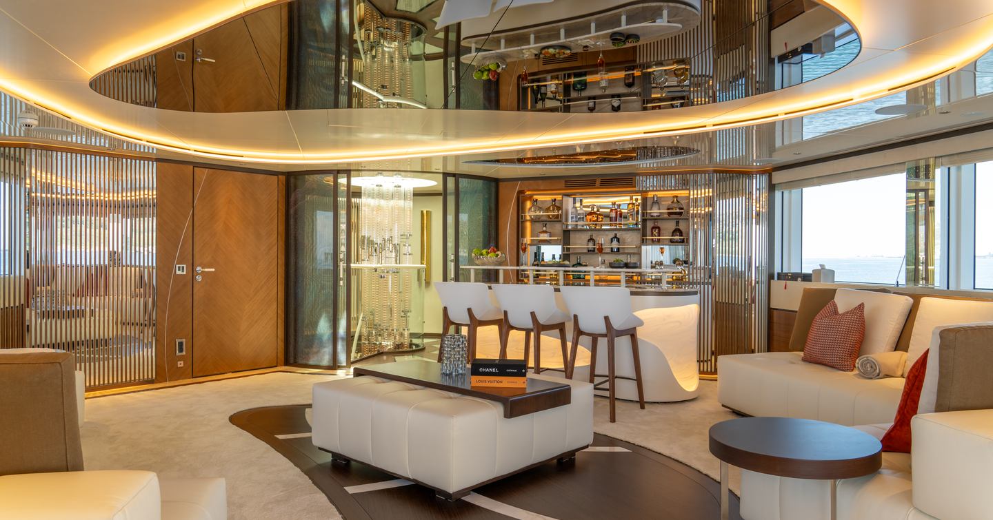 Superyacht Eternal Spark upper deck with curved LED lighting and cream bar area 