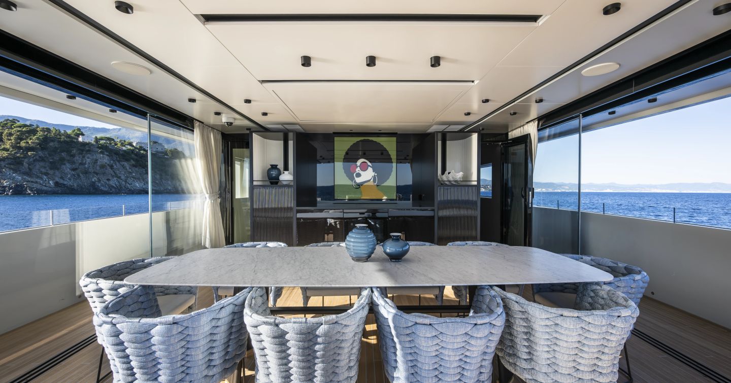 Columbus Atlantique 38M Superyacht Principessa Capricciosa upper deck with large artwork and dining table