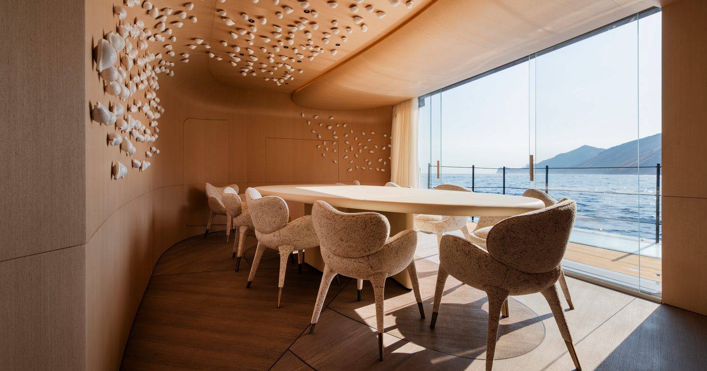 Rossinavi Superyacht Heed private dining area with abstract art and balcony