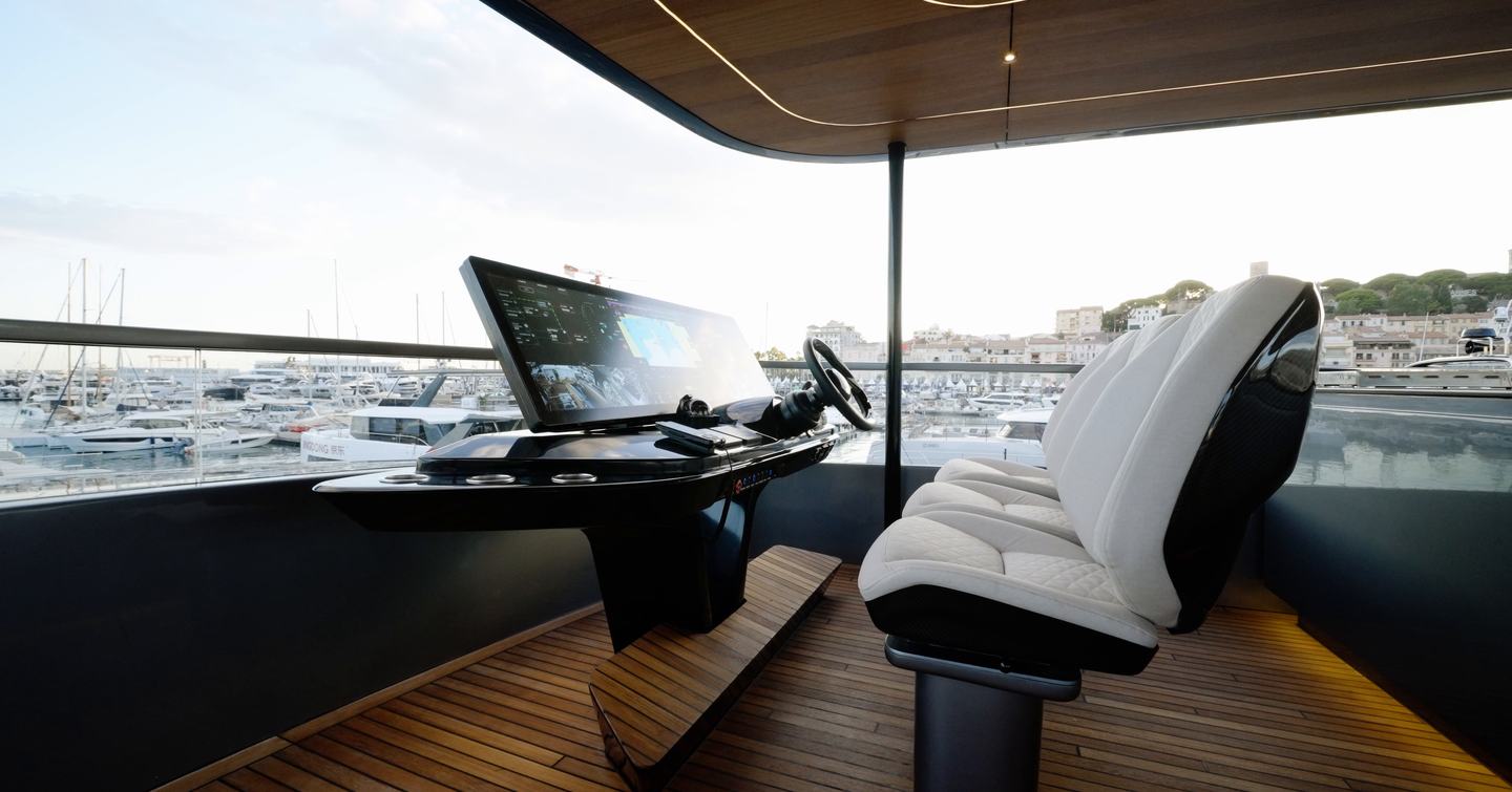 Sunreef Ultima 88 flybridge helm with three seats and large integrated display
