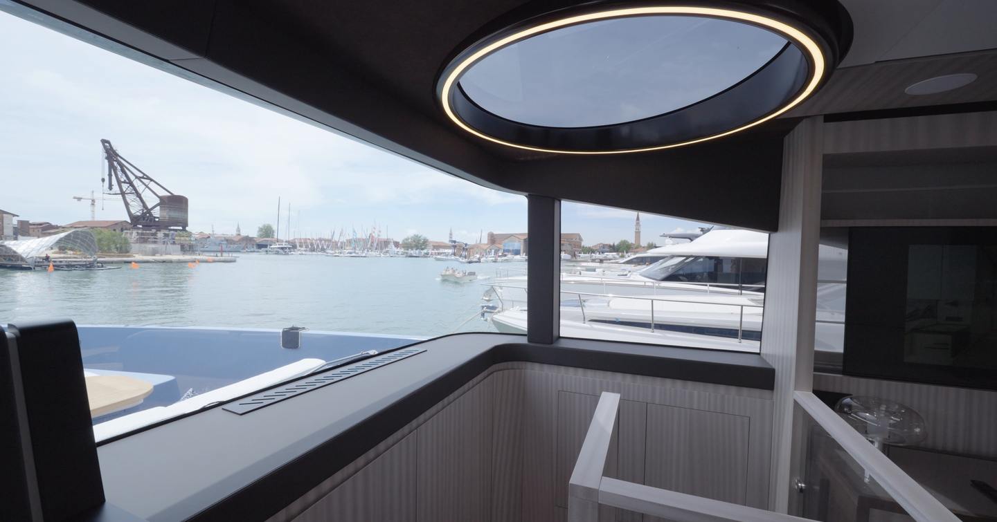 Manda S07 Berlinetta interior showing circular skylight above stairwell and panoramic saloon glazing