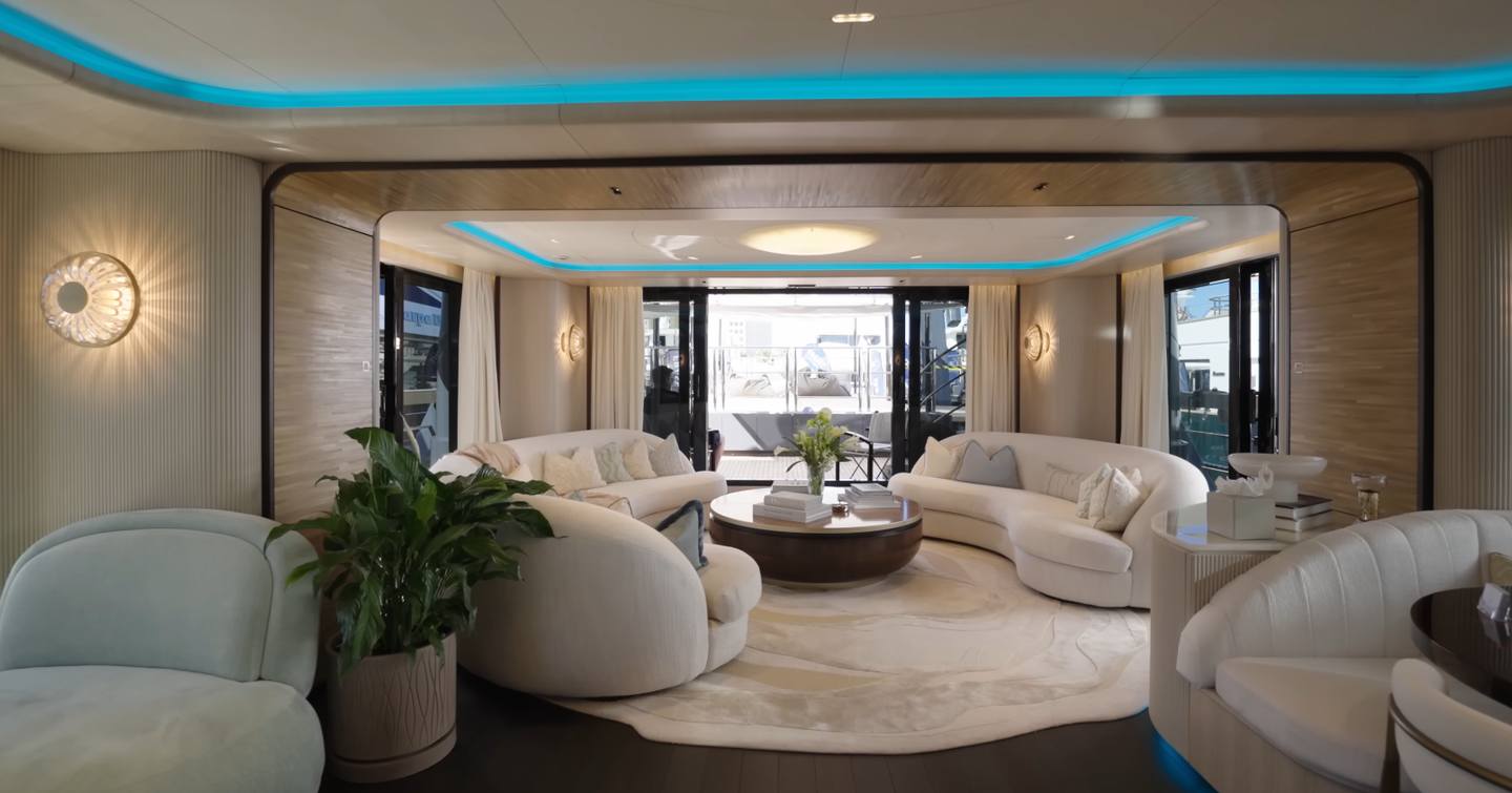 Superyacht Rilassata main saloon with curved white seating 