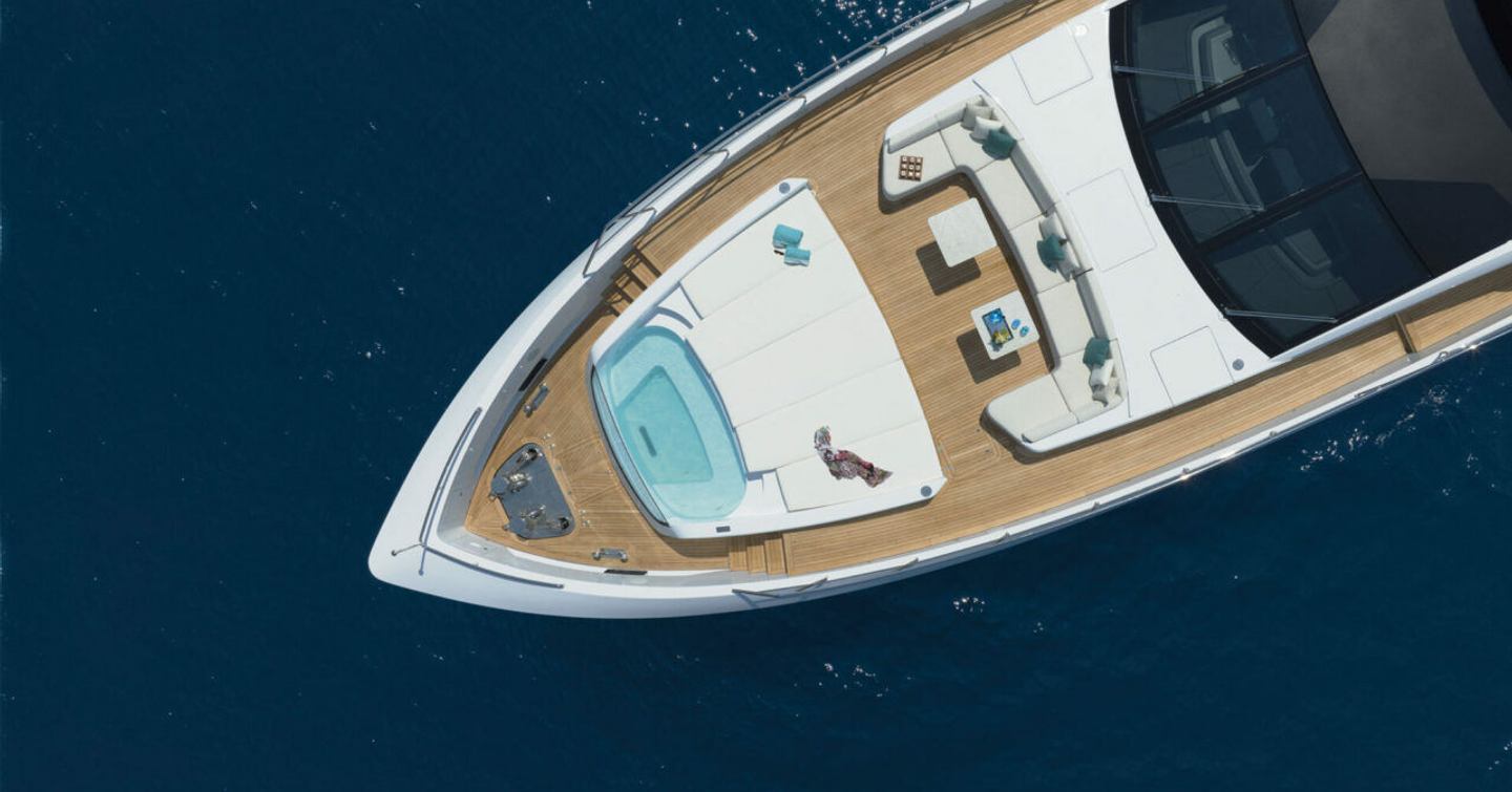 Aerial Rendering of Mangusta GranSport 34 Motor Yacht foredeck with infinity pool and surrounding sunpads 