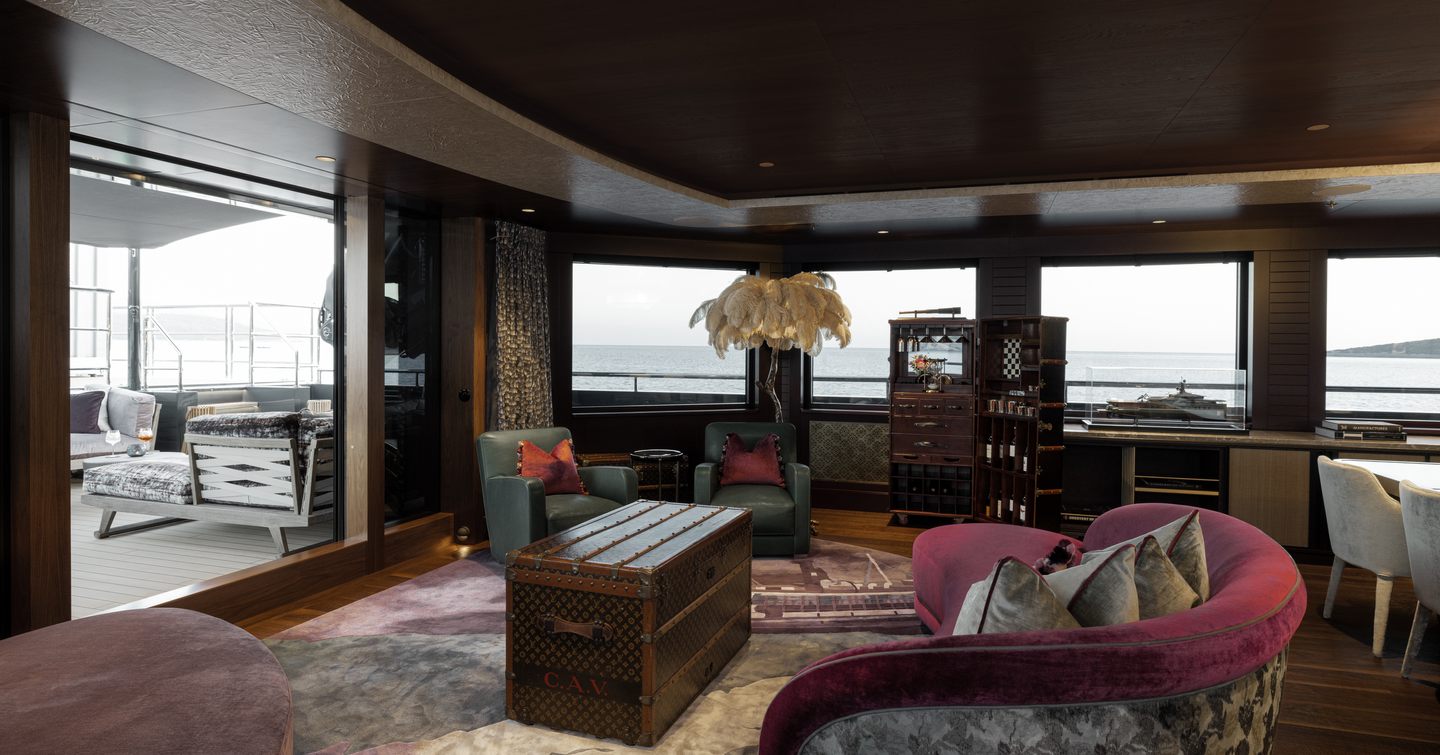 Interior of superyacht Pink Shadow with plush purple seating