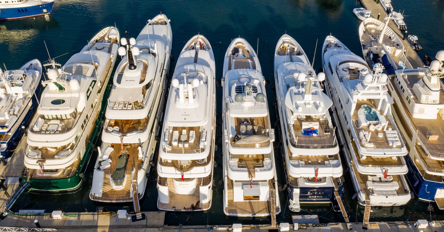 Yachts moored in a row at a marina 