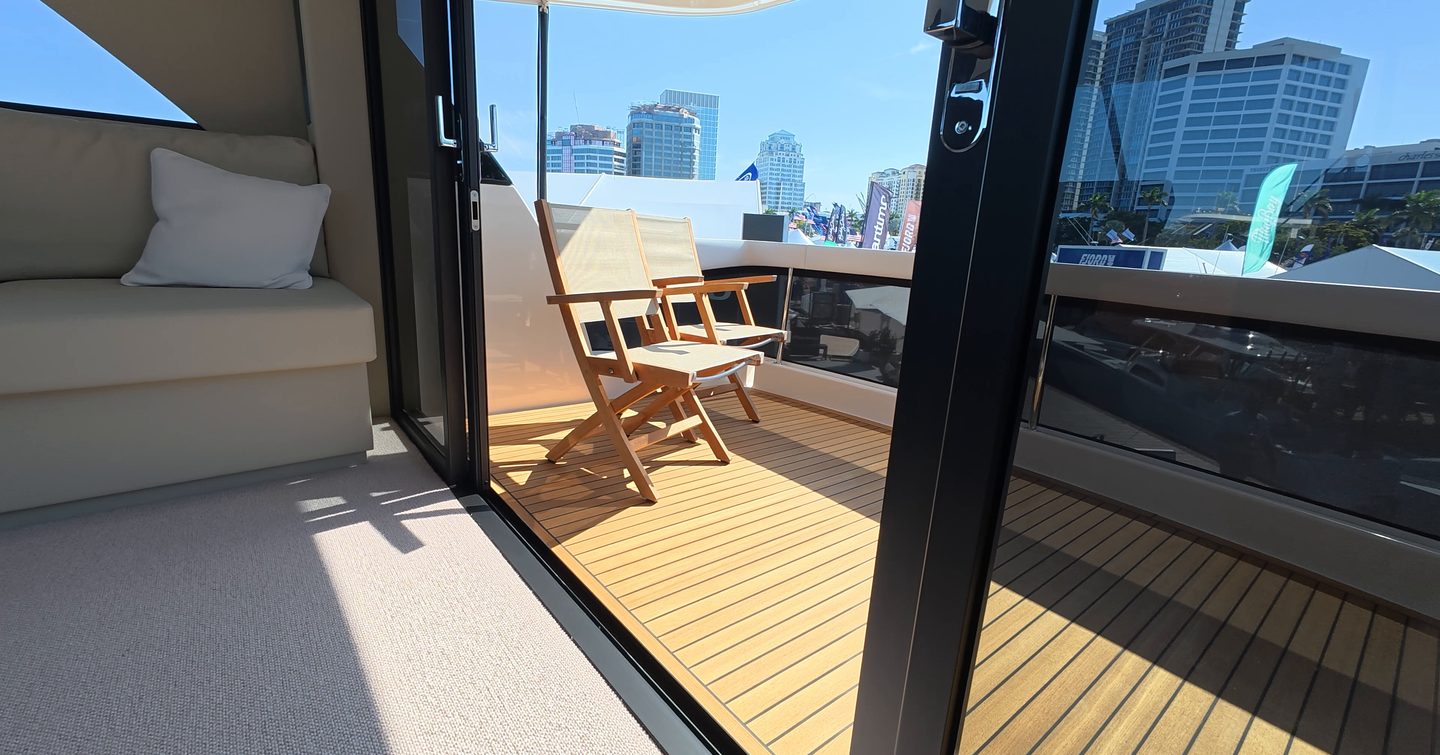 Maritimo M50 flybridge aft terrace with teak decking and outdoor seating area