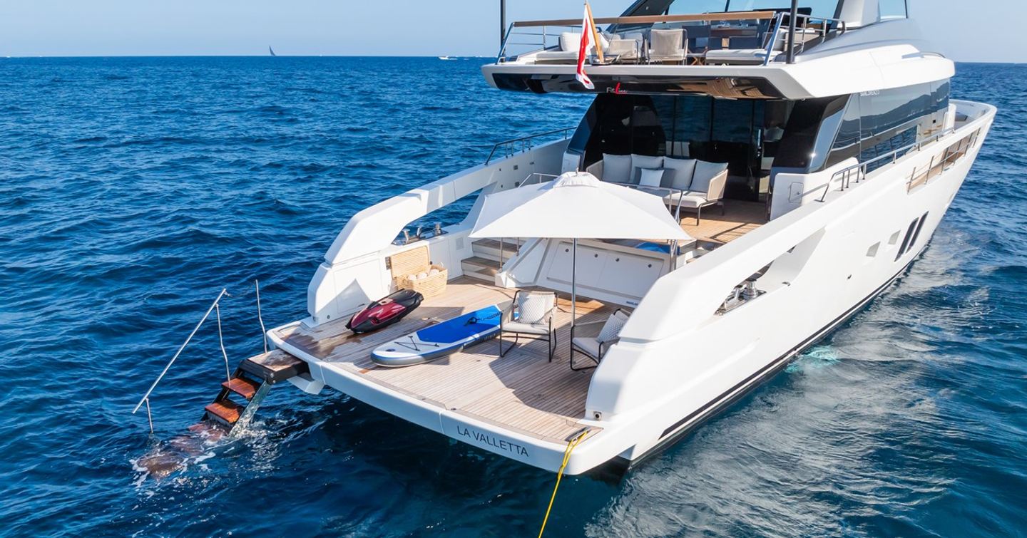 Motor yacht Fitline aft with extended stairs into ocean and toys 