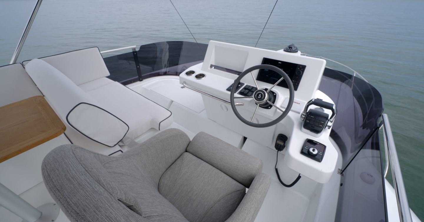 Flybridge helm station with companion seating on the Beneteau Swift Trawler 37 Fly