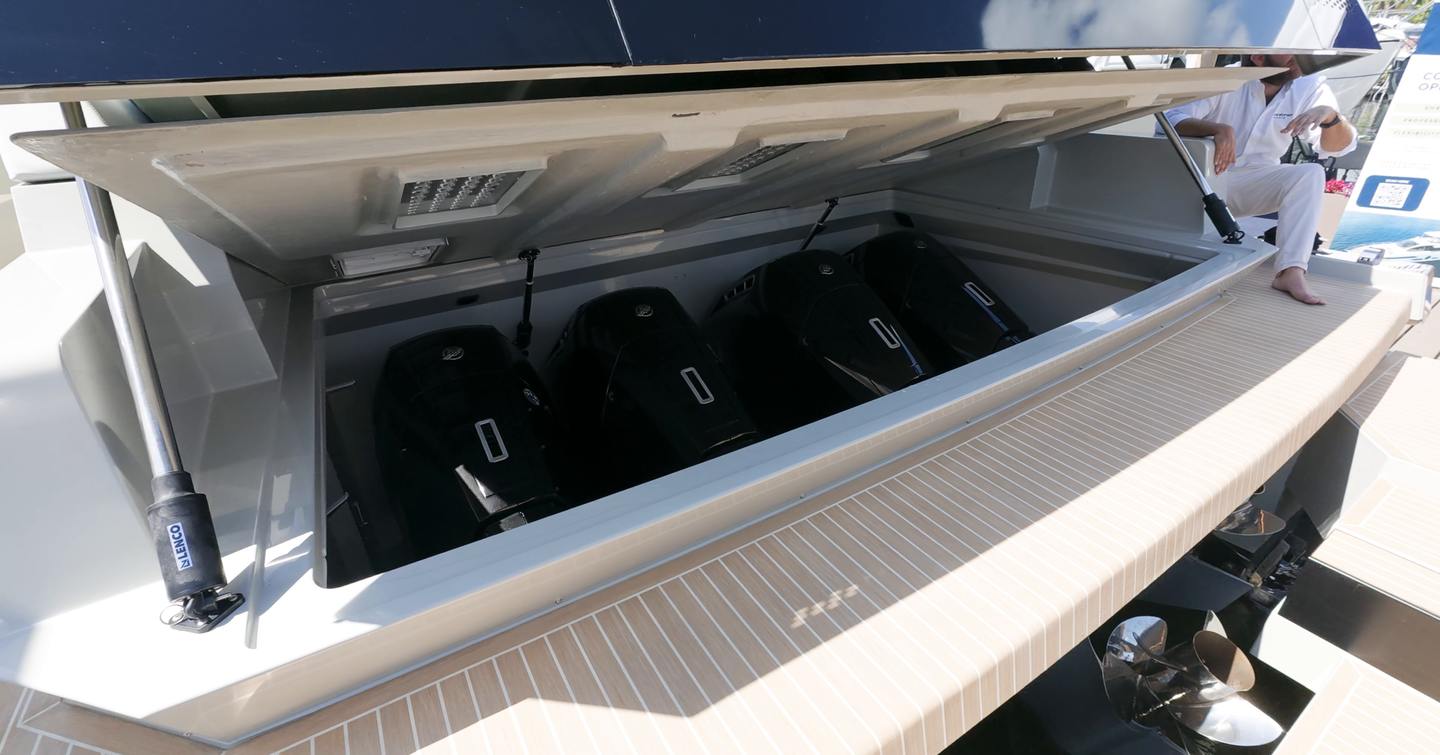 De Antonio D60 hidden Mercury Verado outboard installation beneath aft sun pad structure