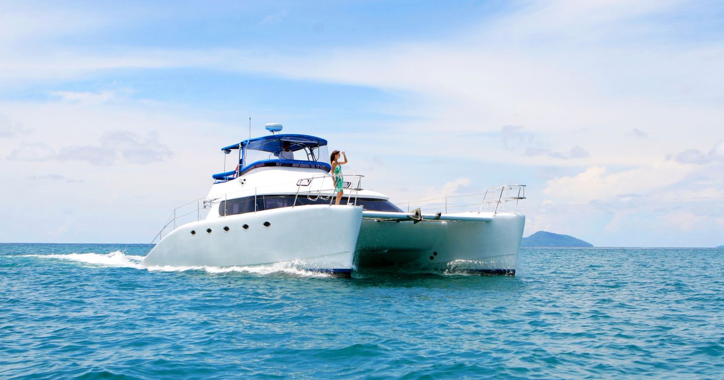 Woman on a yacht looking out at the view 