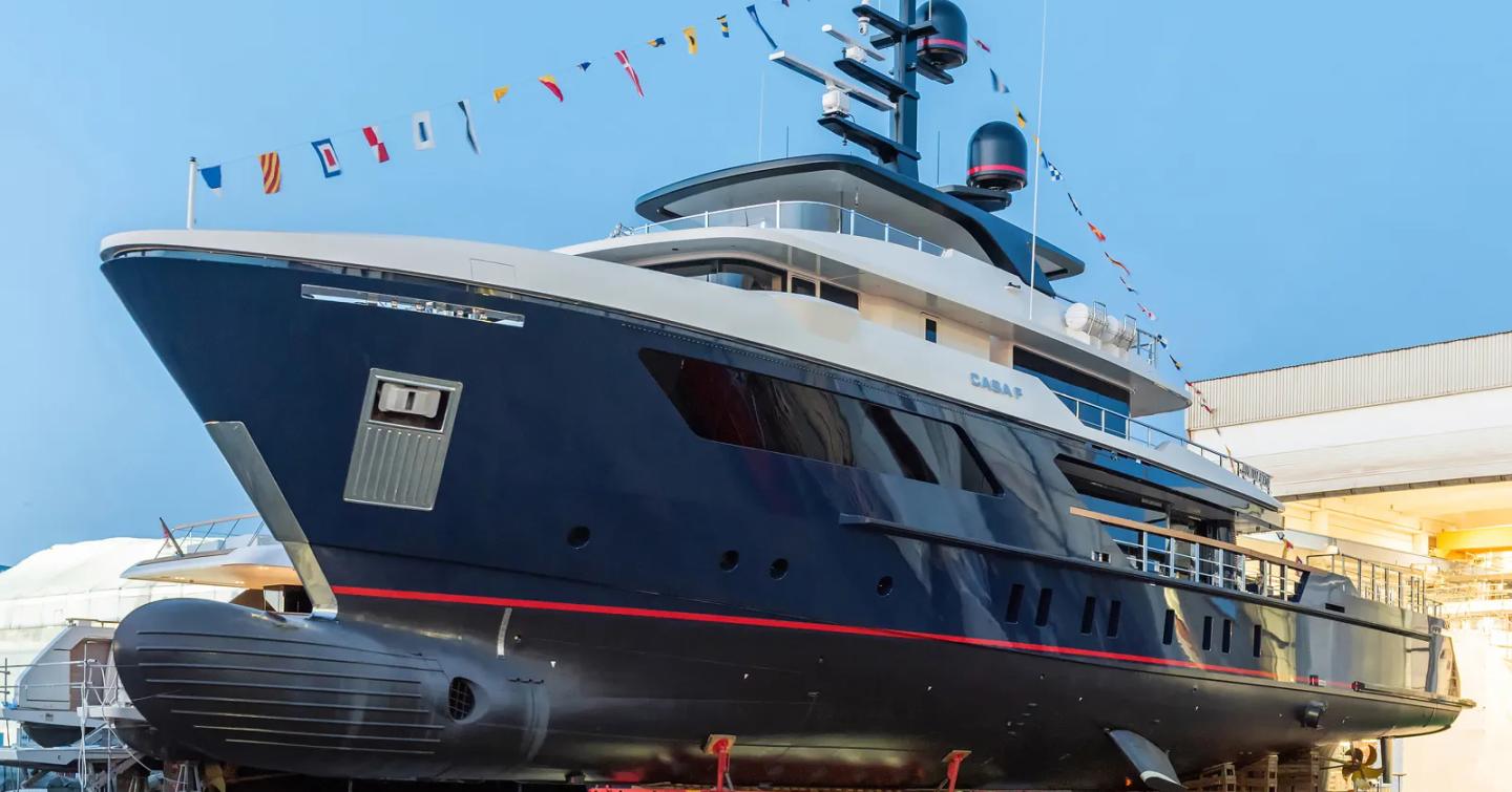 Sanlorenzo 500EXP Explorer yacht Casa F on way to launch with bunting 