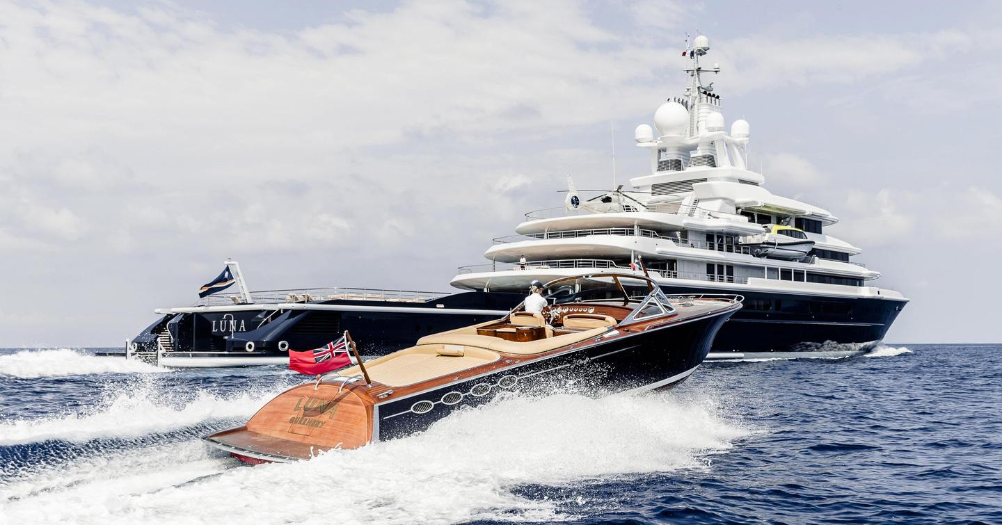 Superyacht Luna underway next to tender
