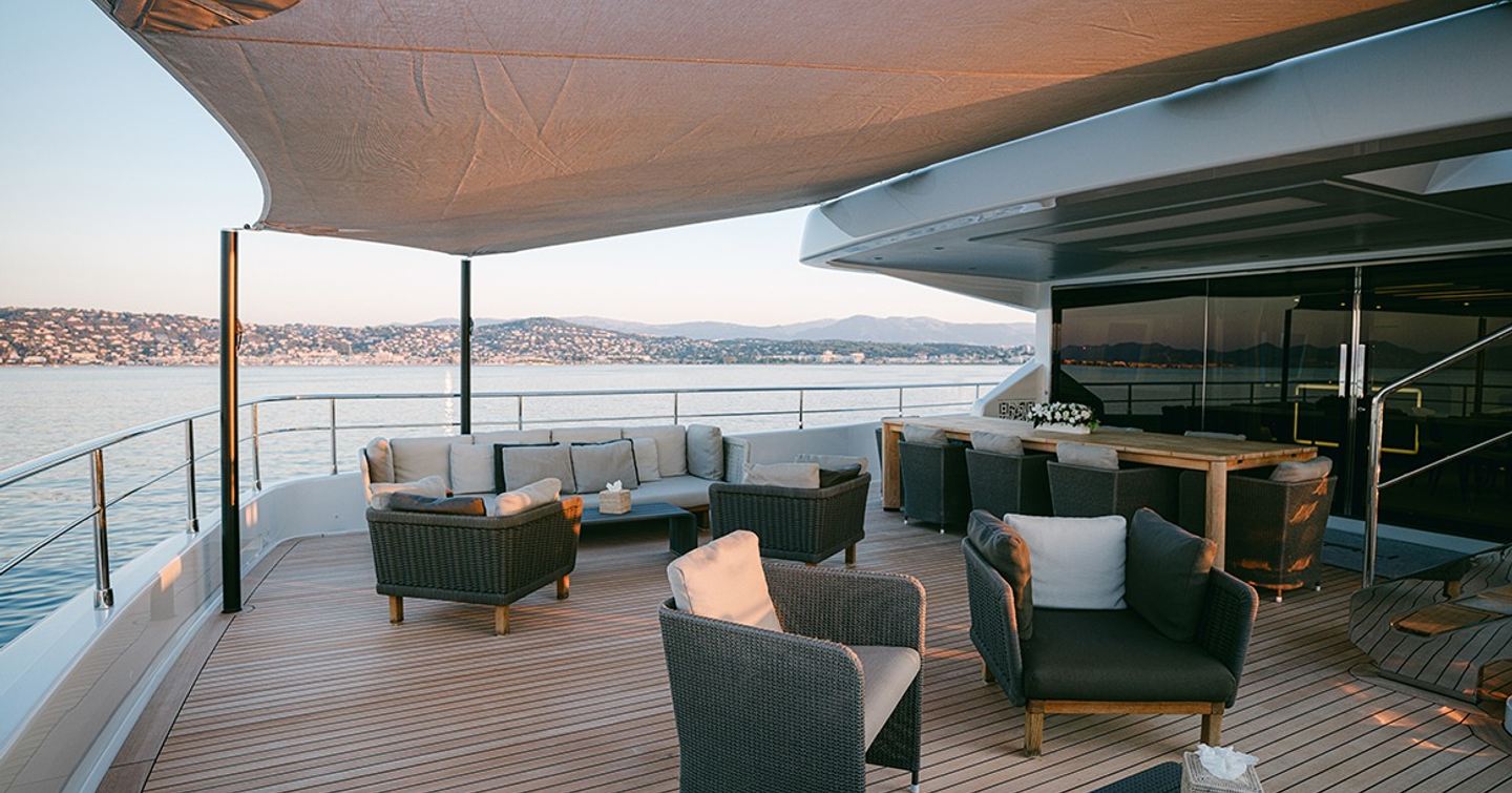 Superyacht Batarli's aft deck with shaded al fresco seating