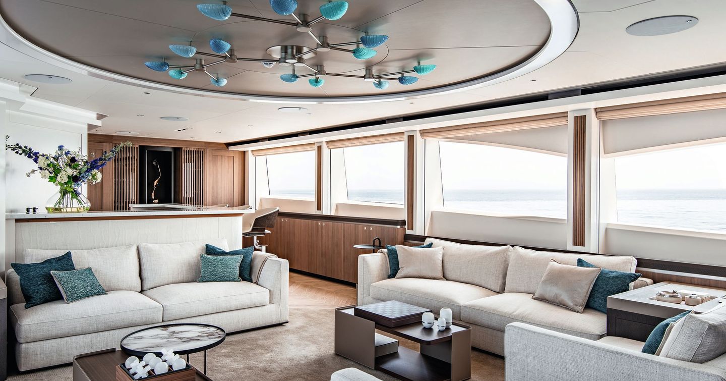 Main salon onboard sportsfisher yacht SPECIAL ONE with plush seating and large windows