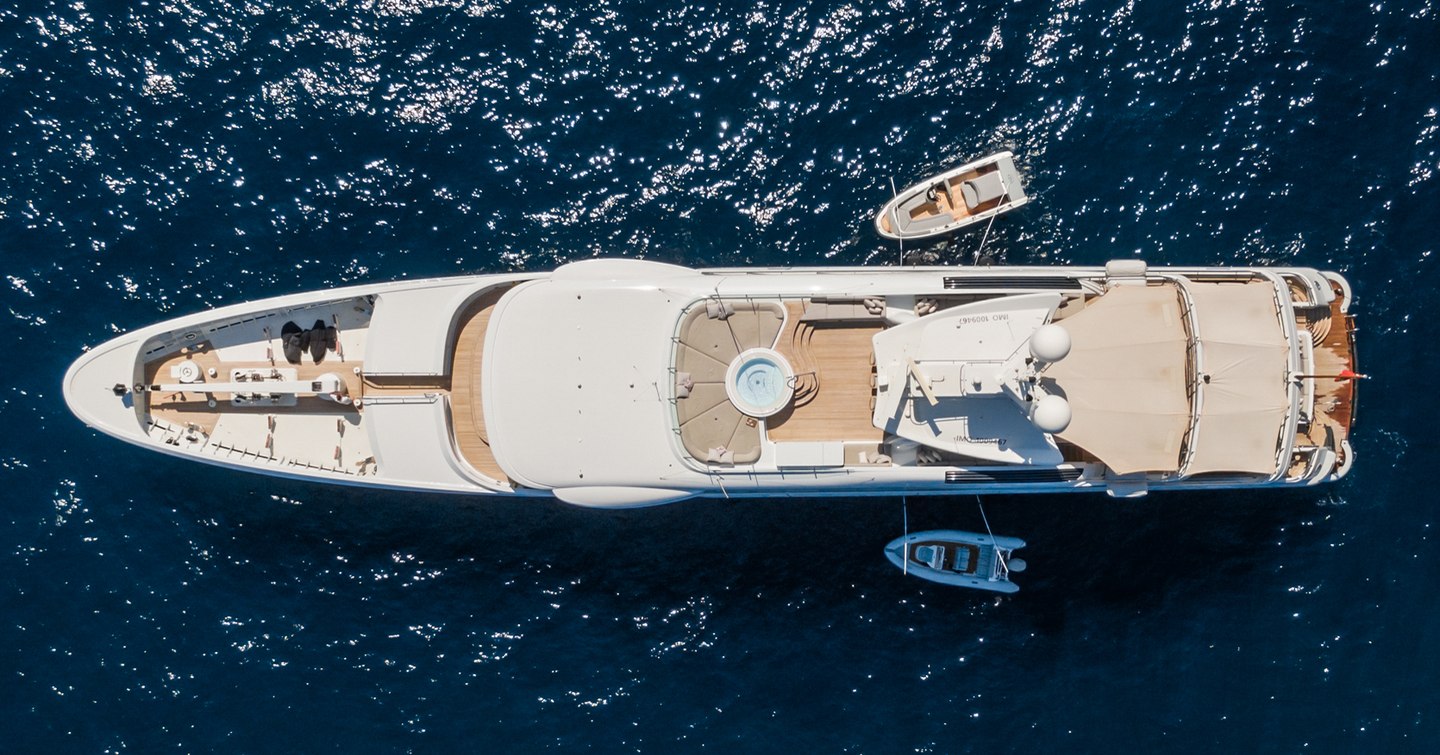 Aerial view of Superyacht Were Dreams at anchor with tenders 