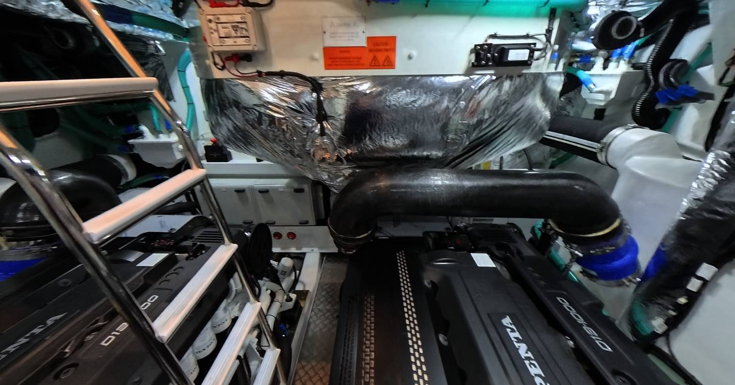 Princess V55 engine room showing Volvo Penta engine and access ladder