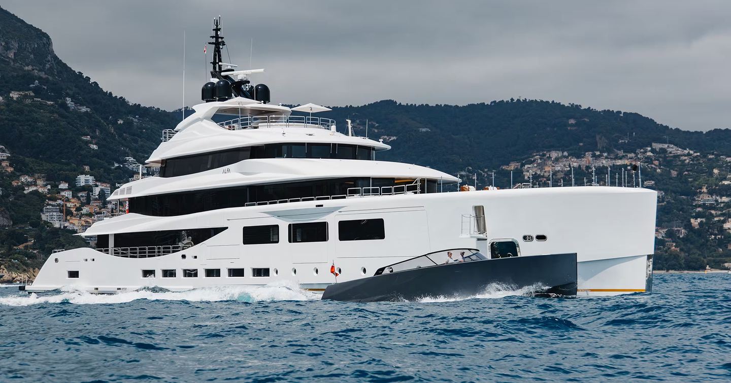Superyacht Alfa next to tender under way