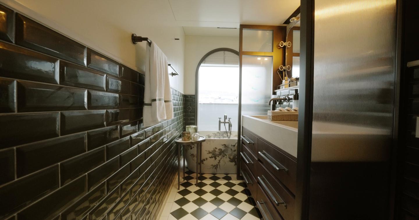 Sirena 118 owner’s ensuite with tiled bath and arched window