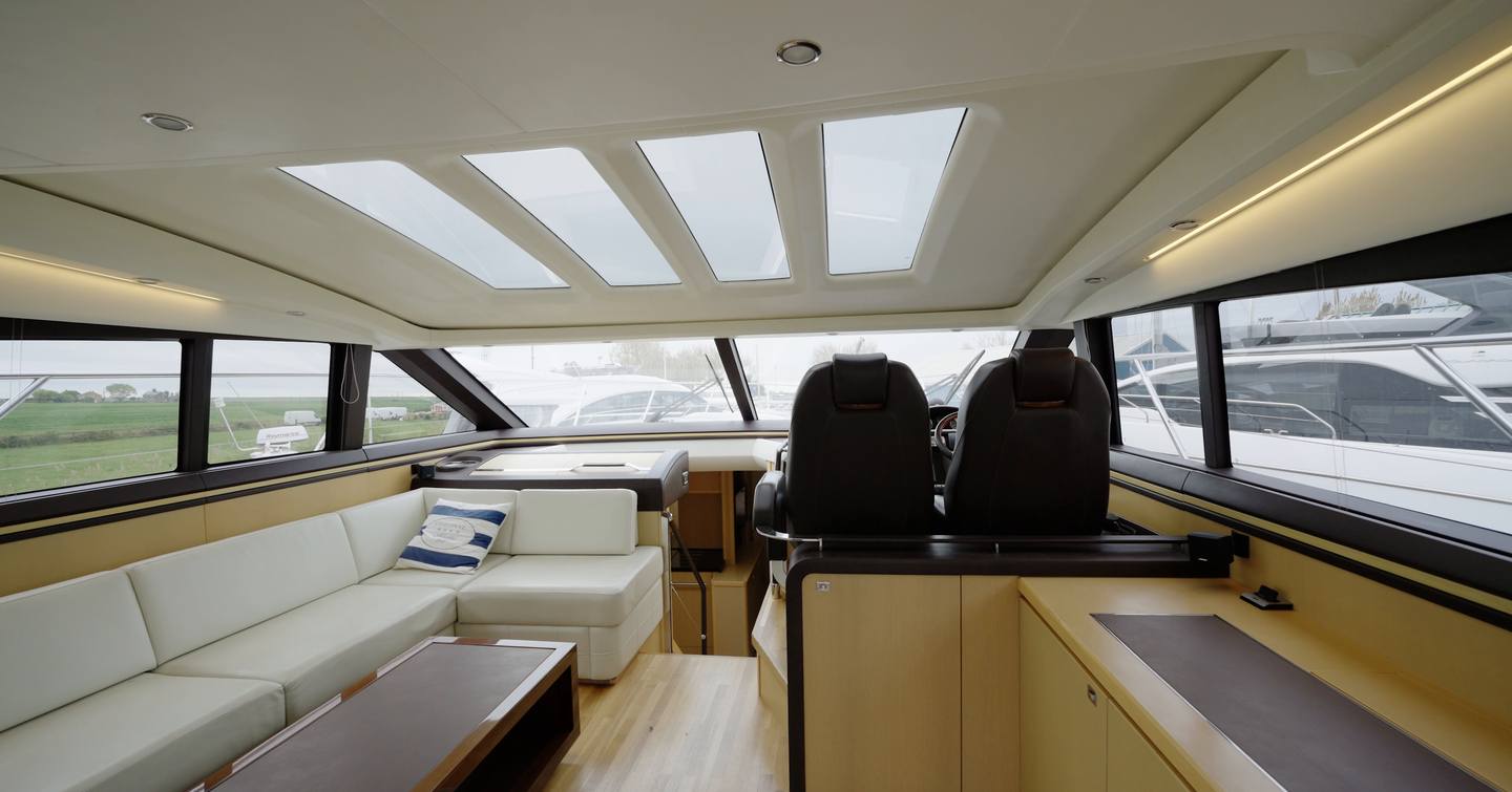 Princess V62 main saloon with helm stations and skylights