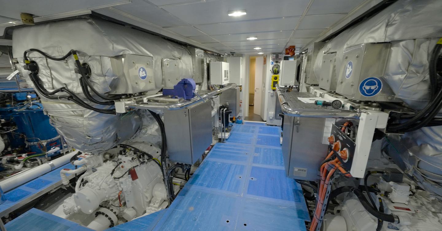 Engine room aboard the Gulf Craft Majesty 145 with twin MTU diesel engines and wide service access