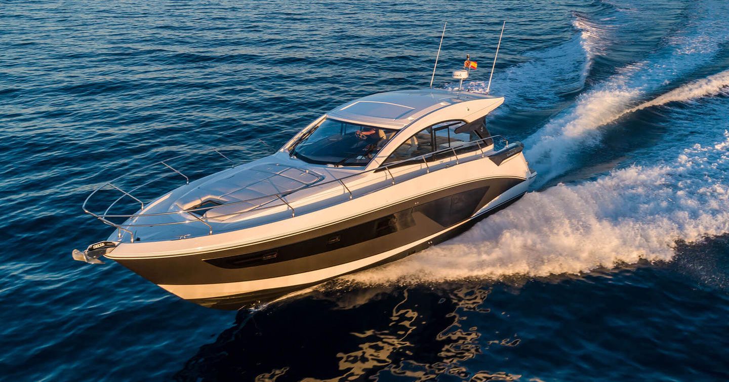 Side view of Beneteau Gran Turismo 45 underway, surrounded by sea.