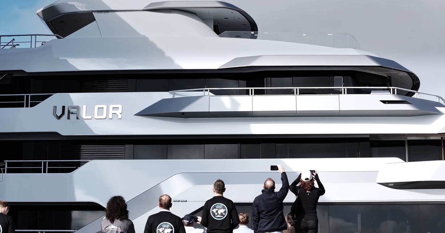 Crowd outside Feaship Yard watching launch
