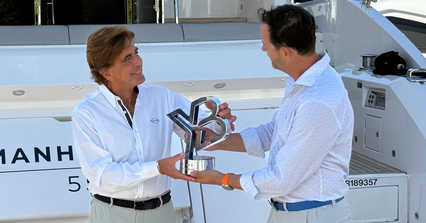 YachtBuyer Hall of Fame award for Sunseeker Manhattan 55 handover by Kevin Bondington