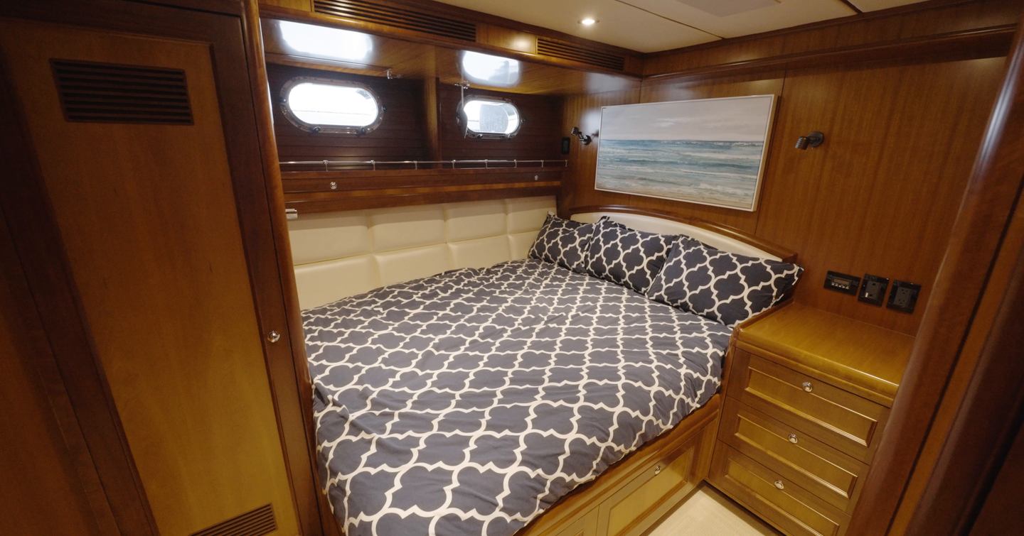 Nordhavn 75 EYF VIP guest cabin with double berth, opening portlights and built-in storage