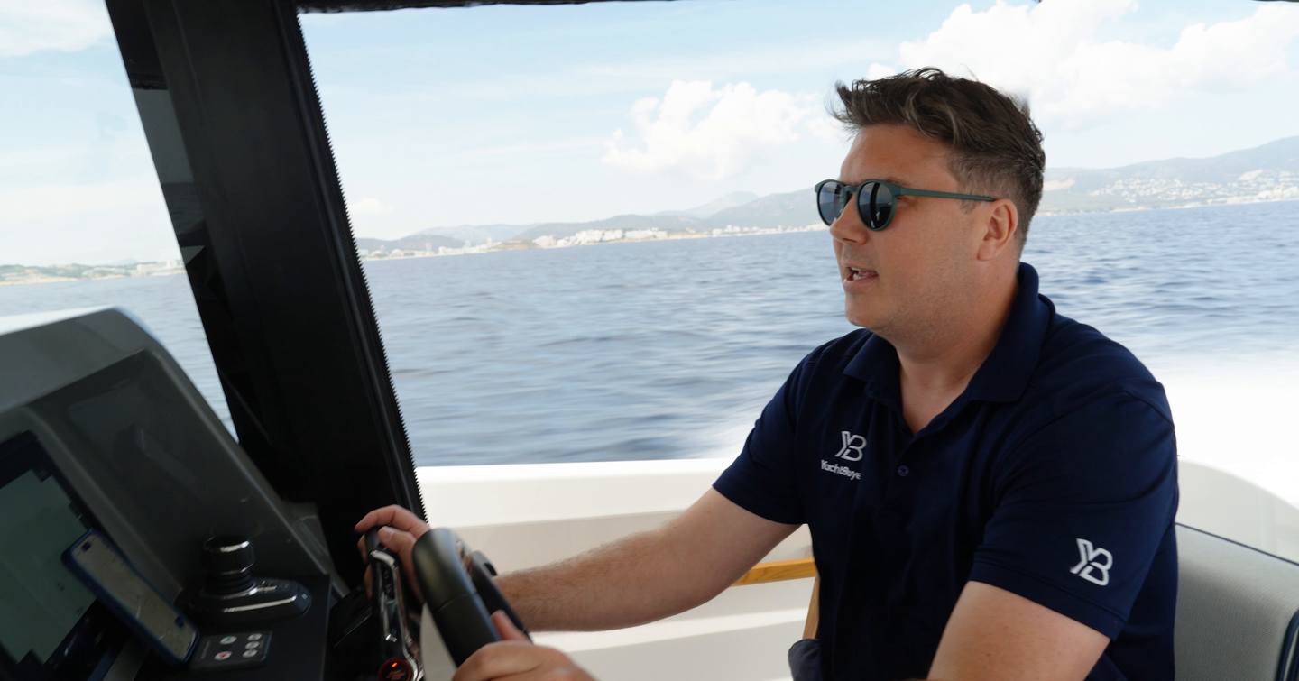 Aiata-Wayfinder-38-Suntop-Review-helm-position-underway-with-Jack-at-the-wheel