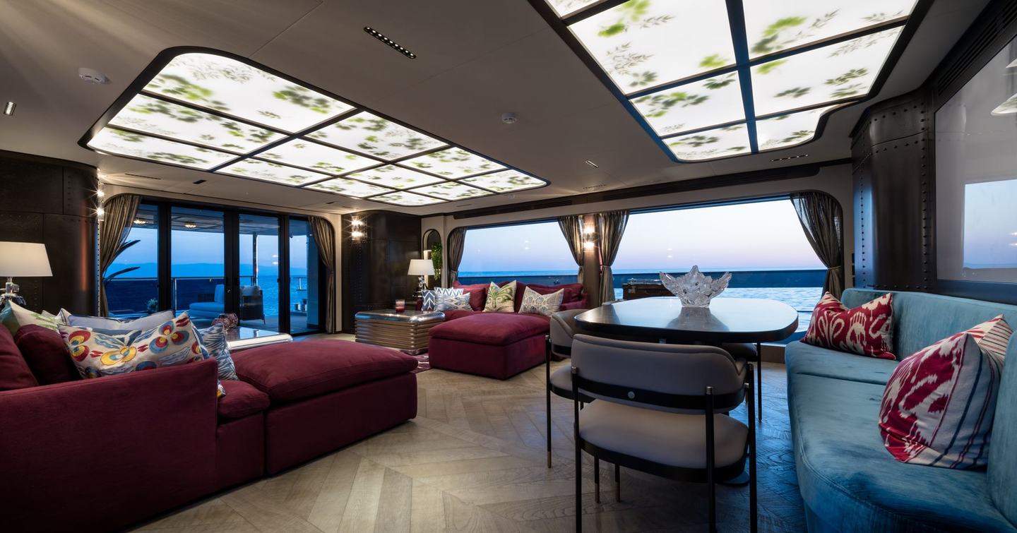 Sirena 118 Superyacht IKIGAI salon with dual purple seating