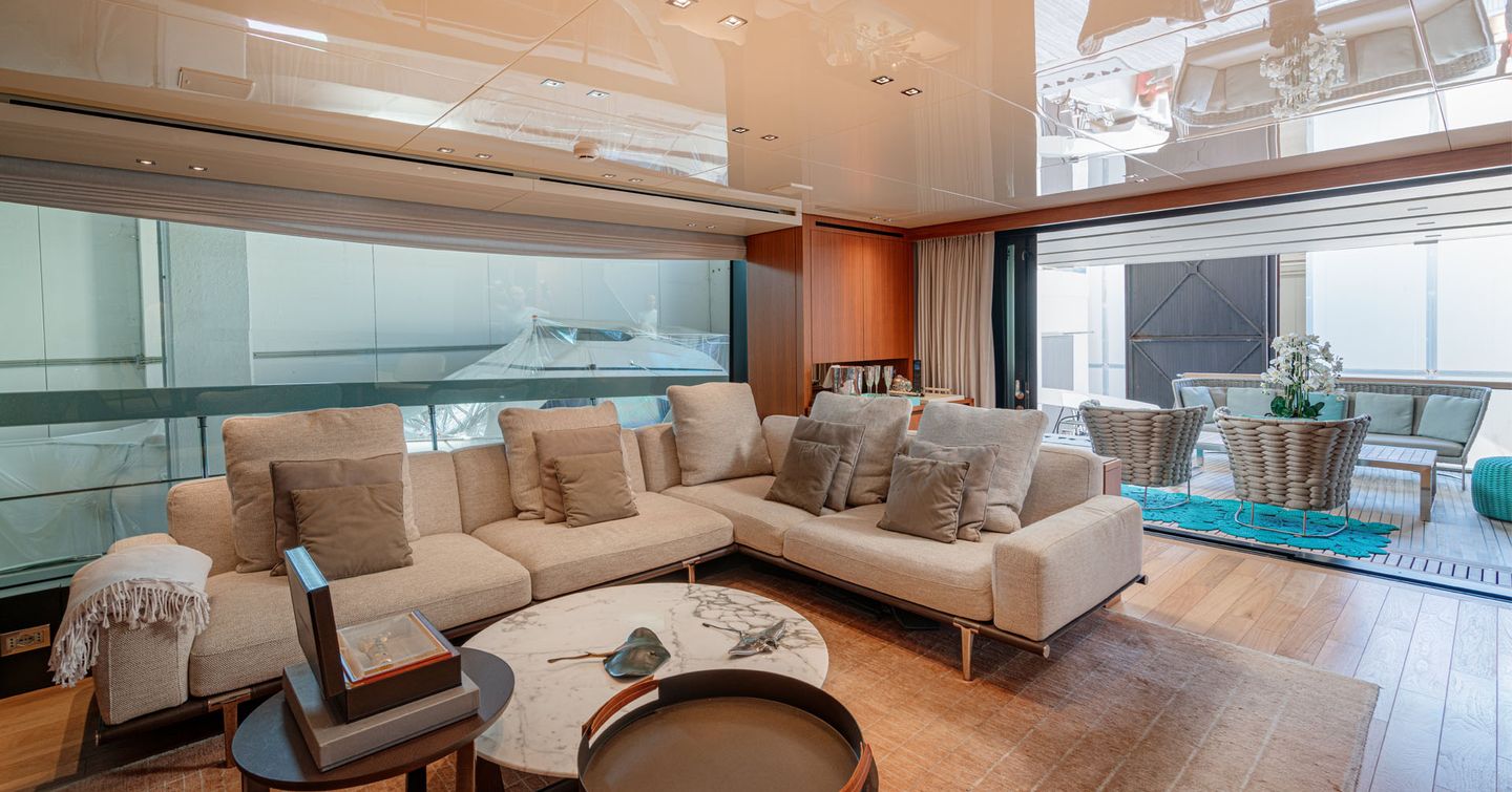 Motor yacht M&M's main saloon with L-shaped sofa