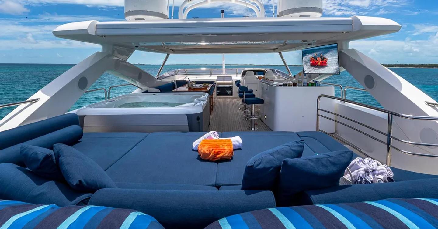 Motor yacht Emrys sundeck with bar area, jacuzzi and sunpads