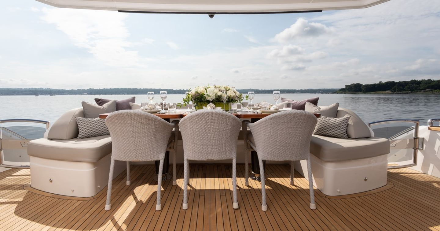 Motor yacht Lady J aft deck shaded alfresco dining