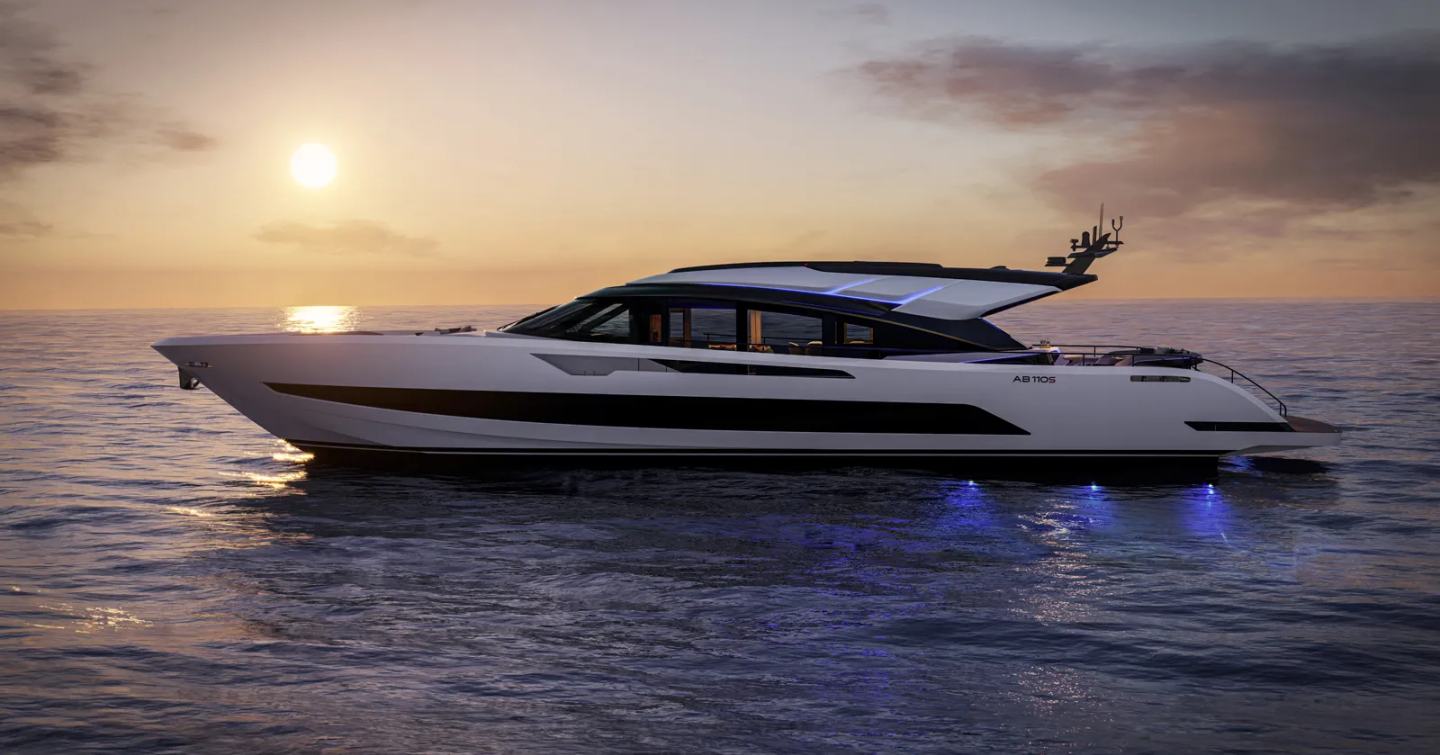 AB Yachts AB 110S motor yacht at anchor at dusk