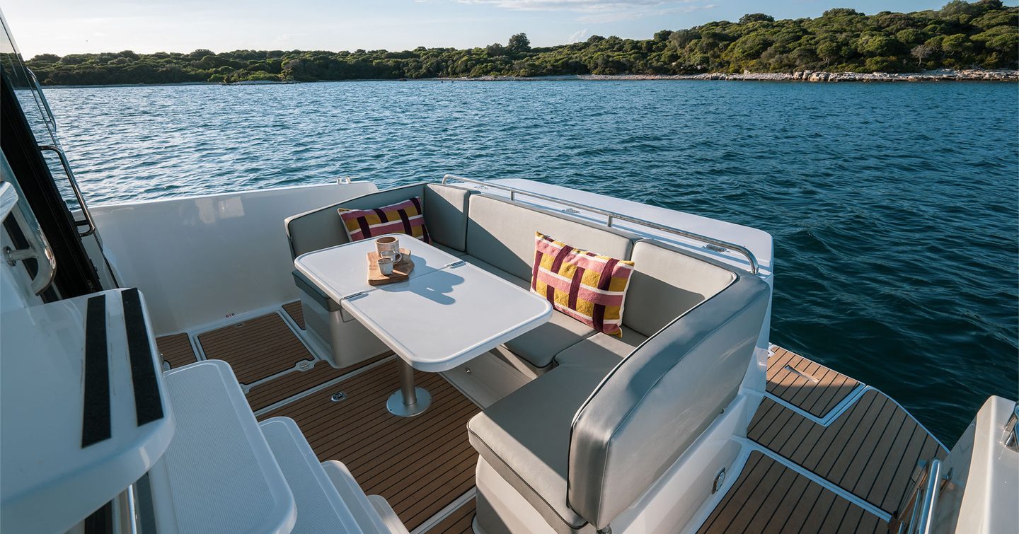 Updated Delphia 11 Flylounge Motor Yacht aft deck with U-shaped seating 