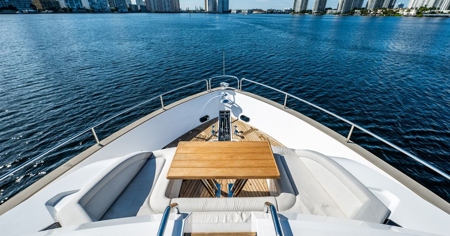 Motor yacht Mandala's foredeck with seating and table