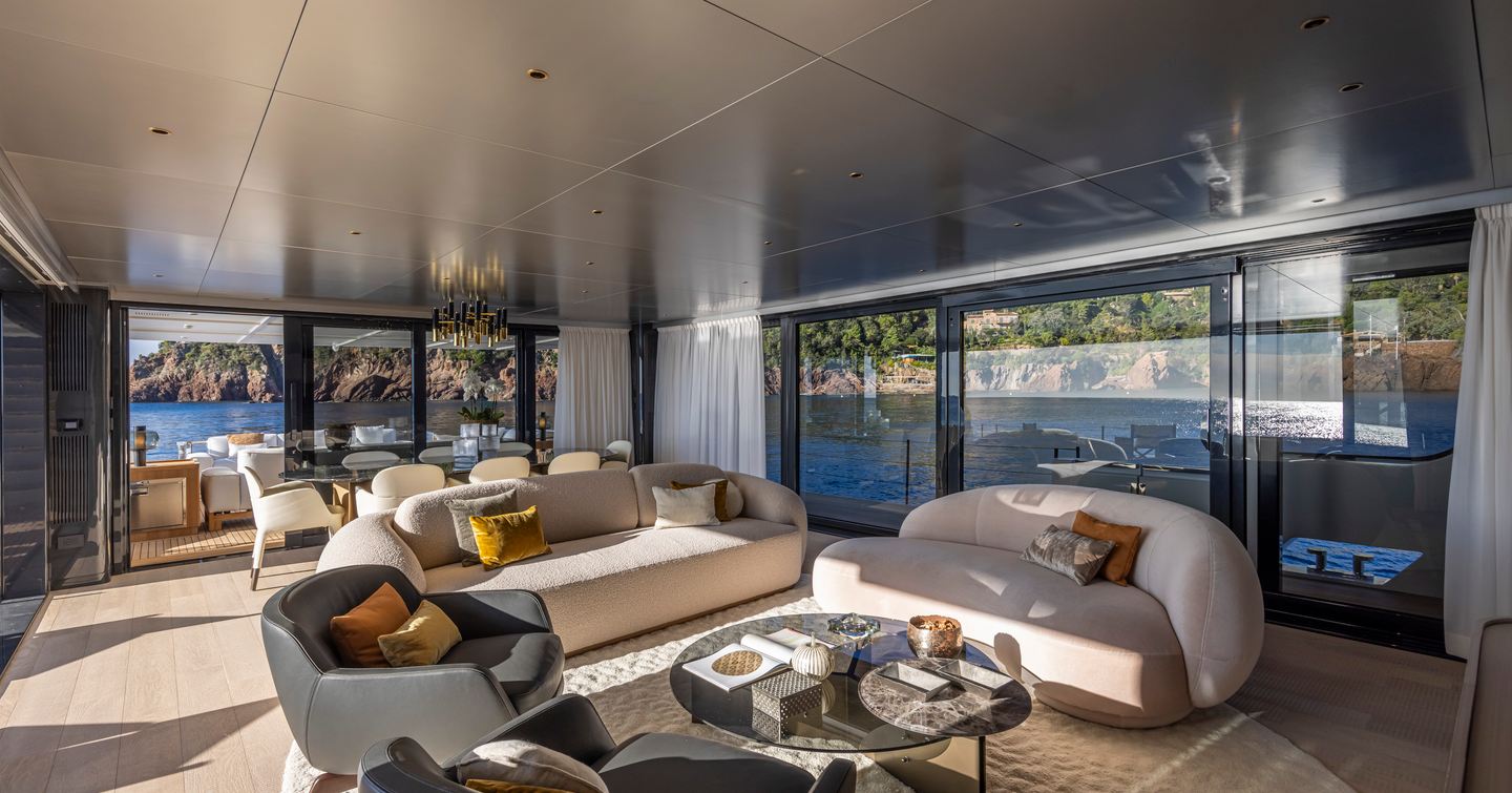 Fourth 29m Arcadia A96 Yacht main saloon with curved seating and dining area