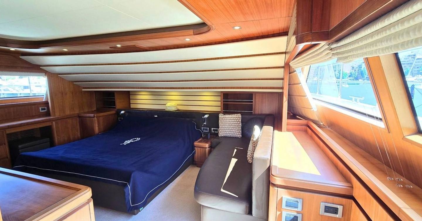 Bleu Blanc main cabin with double bed, seat and large window