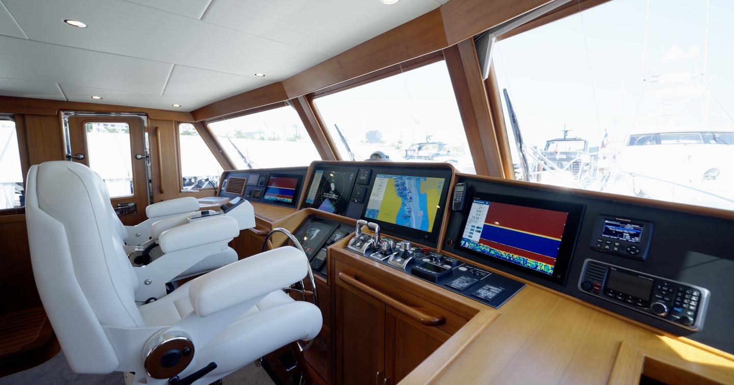 Fleming 85 raised pilothouse helm with Furuno navigation displays and STIDD helm seats