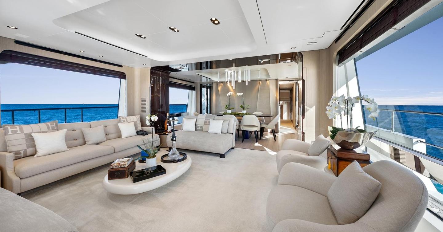 superyacht main saloon with white sofa seating and coffee table