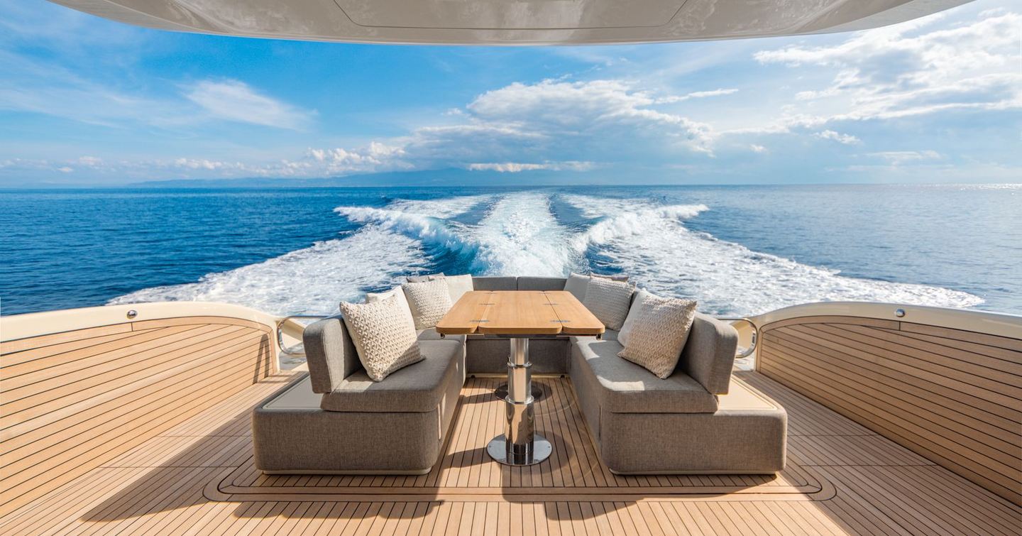 Invictus ST550 motor yacht aft deck with alfresco dining while under way