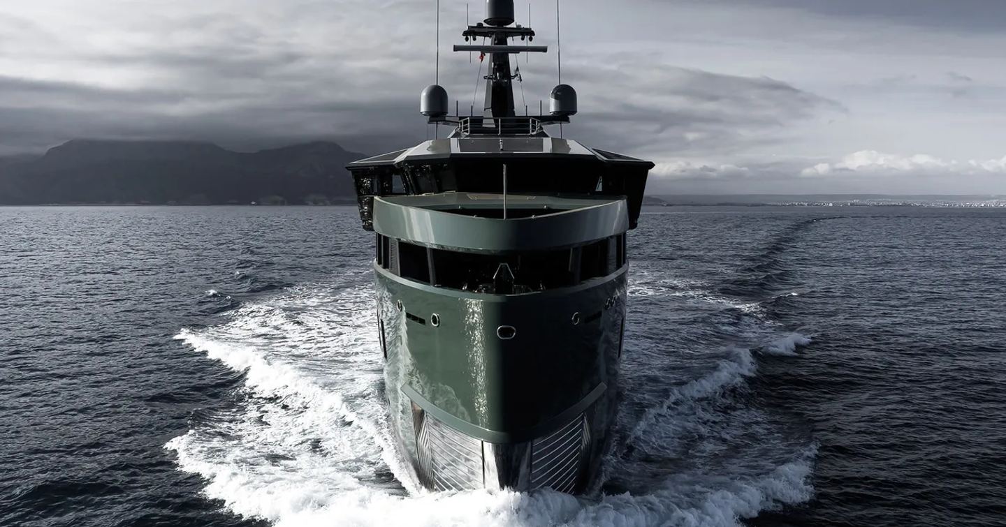 Onward looking shot of the bow onboard Pink Shadow, running shot surrounded by sea and dark clouds overhead.