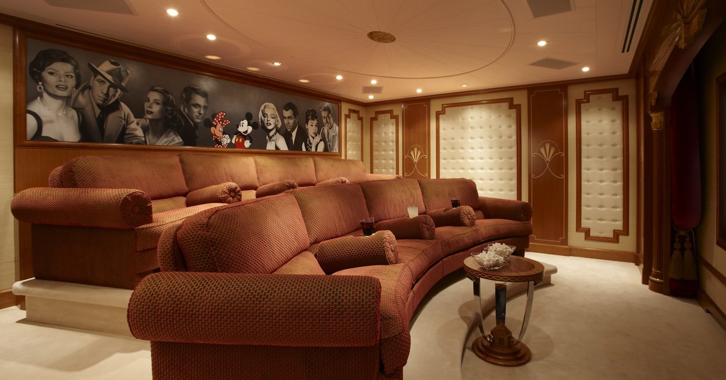 Lady Christine's cinema room with comfortable burgundy sofas