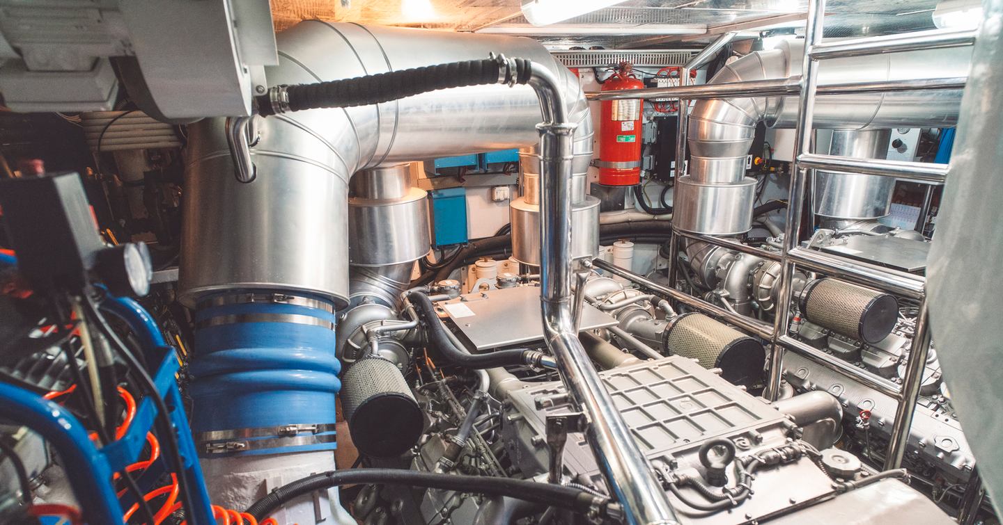 Yacht engine room with silver pipes 
