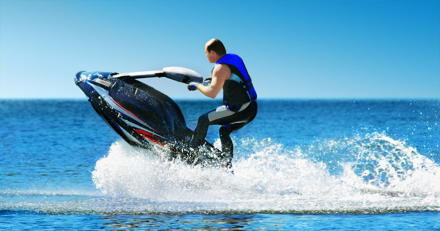 Man on jet ski doing a trick 