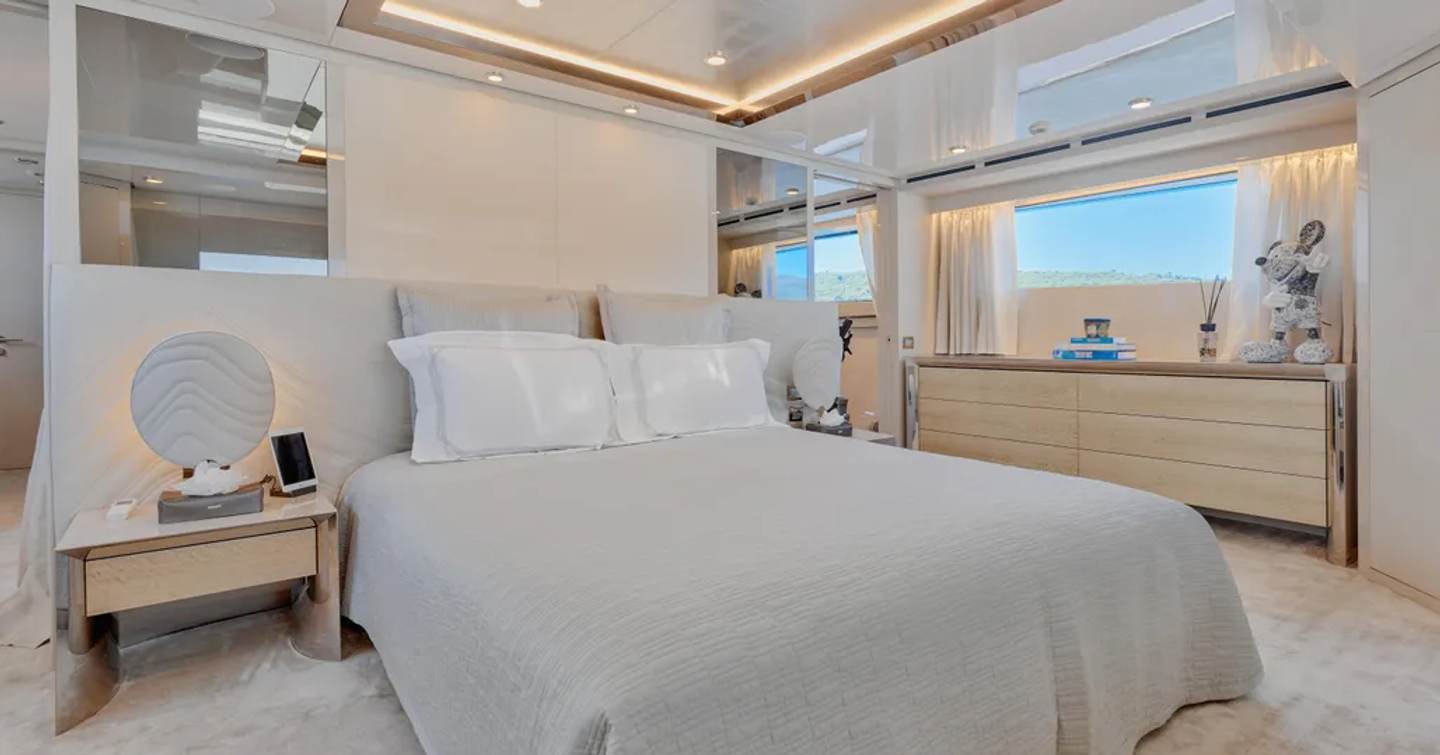 Superyacht Amorcito's master cabin, with cream furnishings  